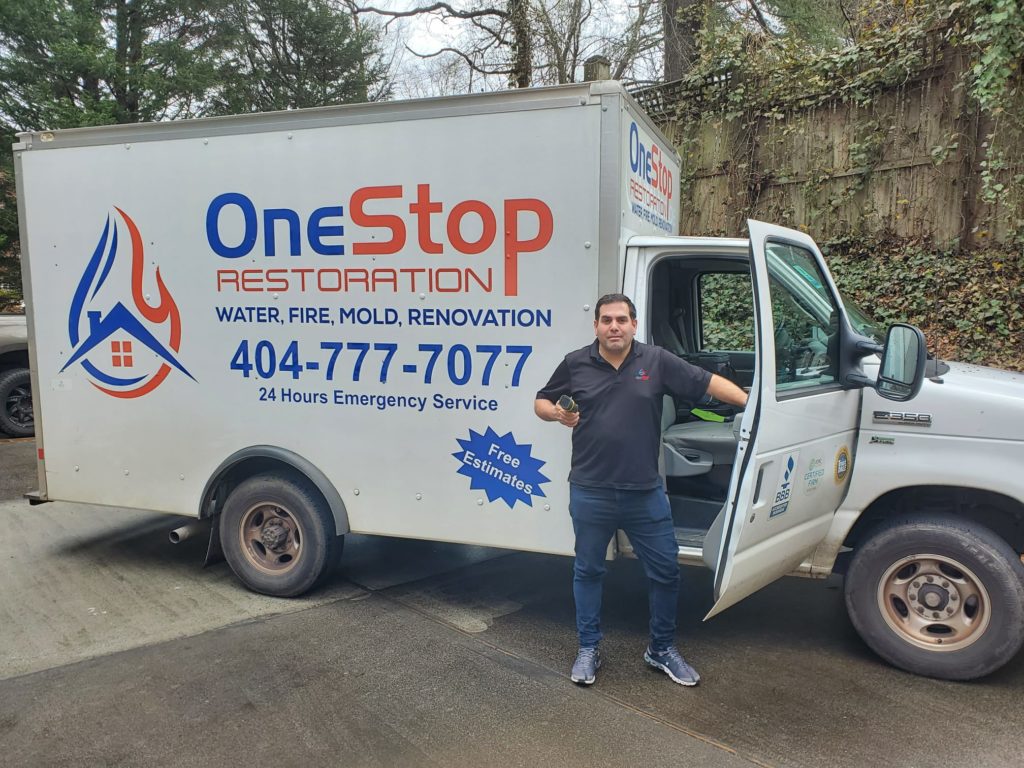 One stop restoration employee and water damage unit