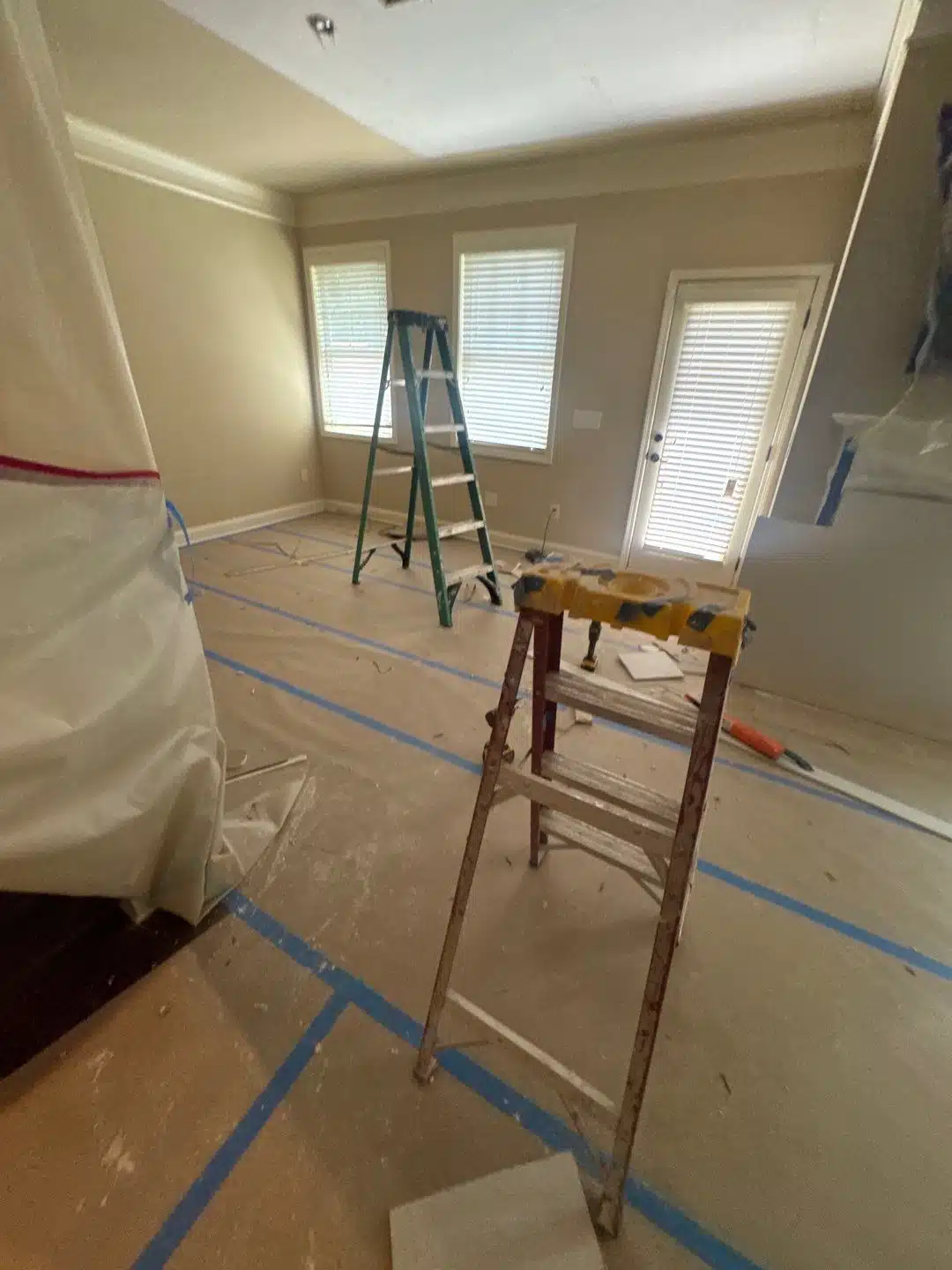 Floor protection and containment taped off before ceiling demolition begins