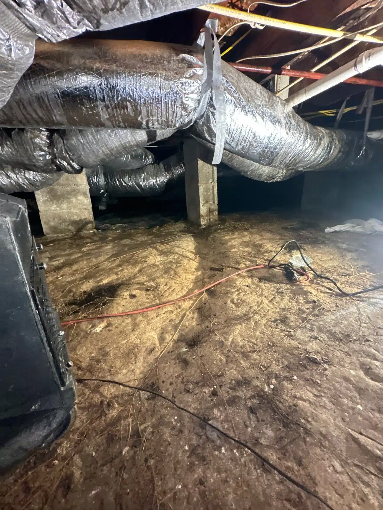 Staining across the underside of the subfloor and around the duct penetrations