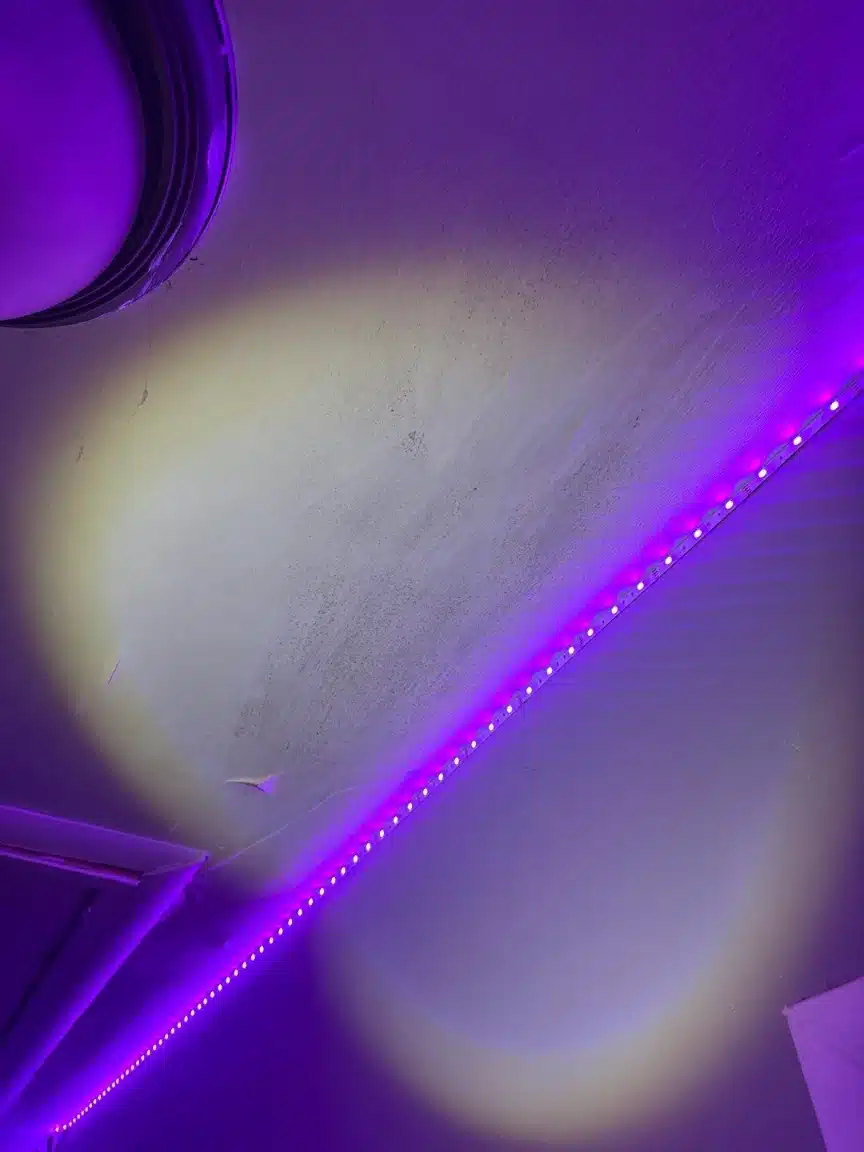 Finished hallway ceiling with the homeowner's LED cove lighting running along the edge