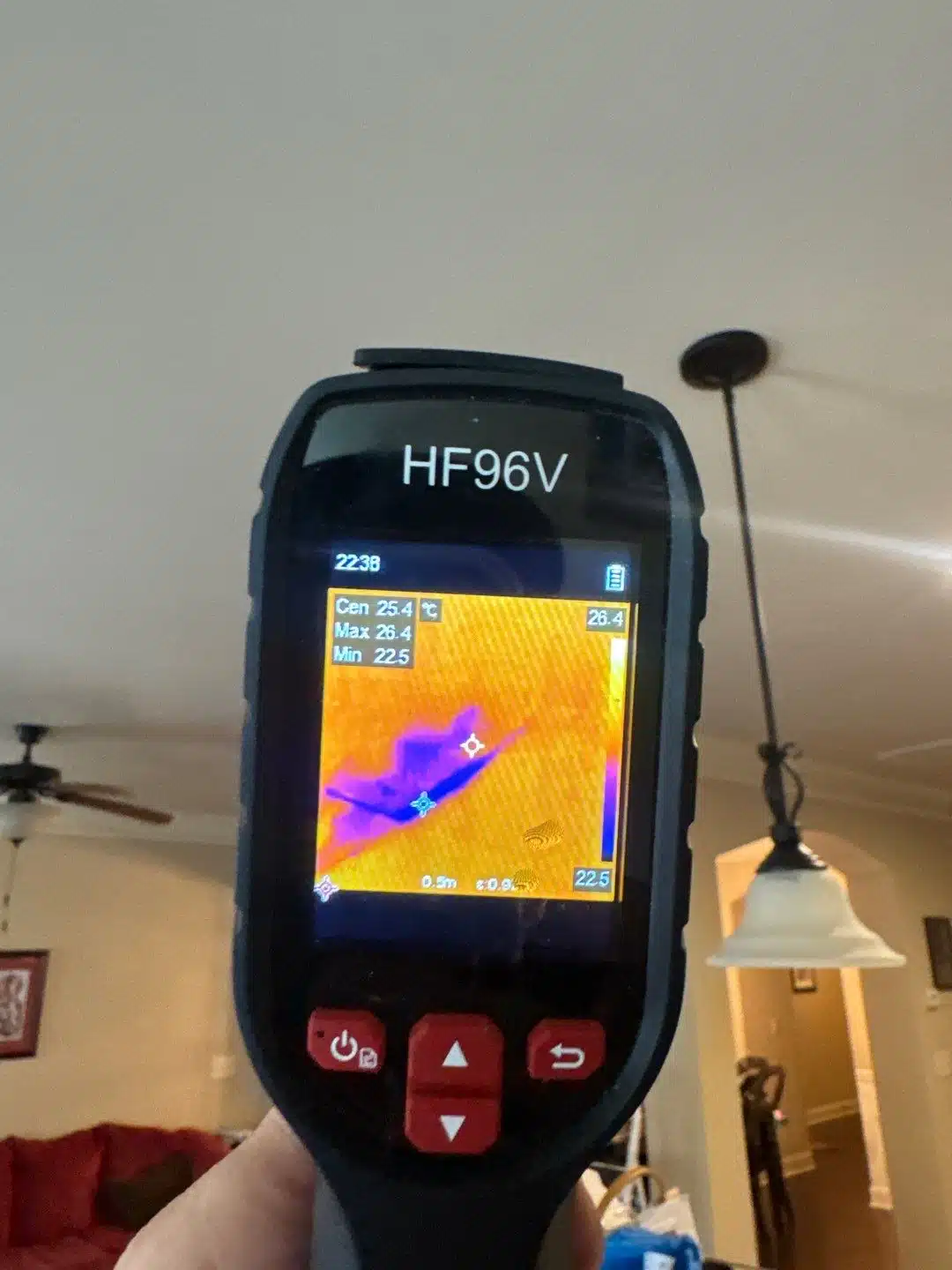Thermal imaging camera showing trapped moisture in the ceiling below a second-floor bathroom