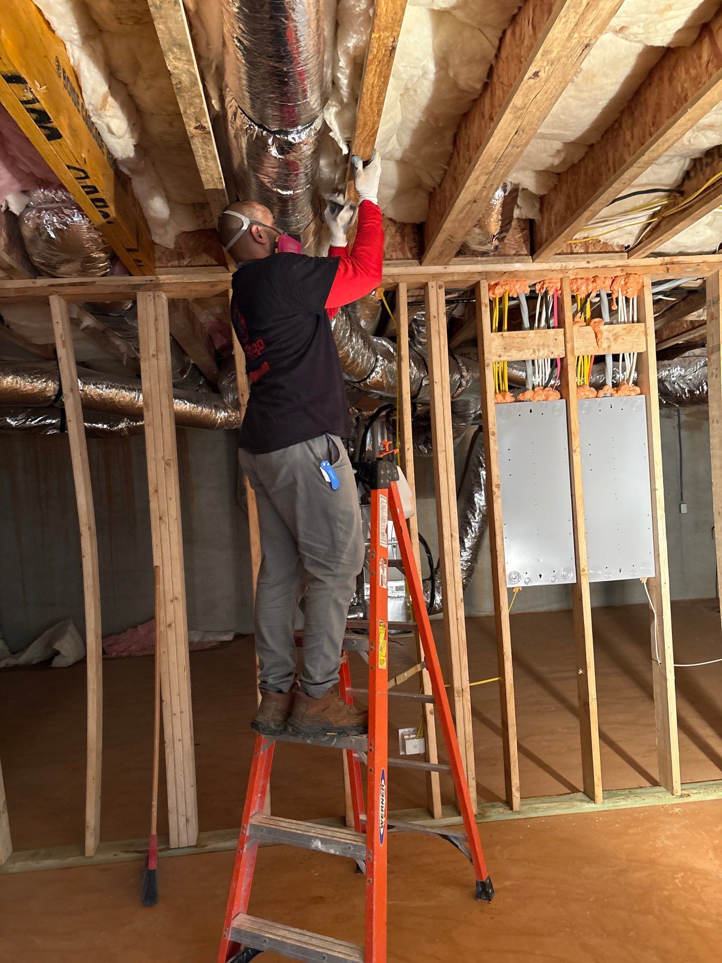 A room stripped back after mitigation, with materials removed ahead of reconstruction