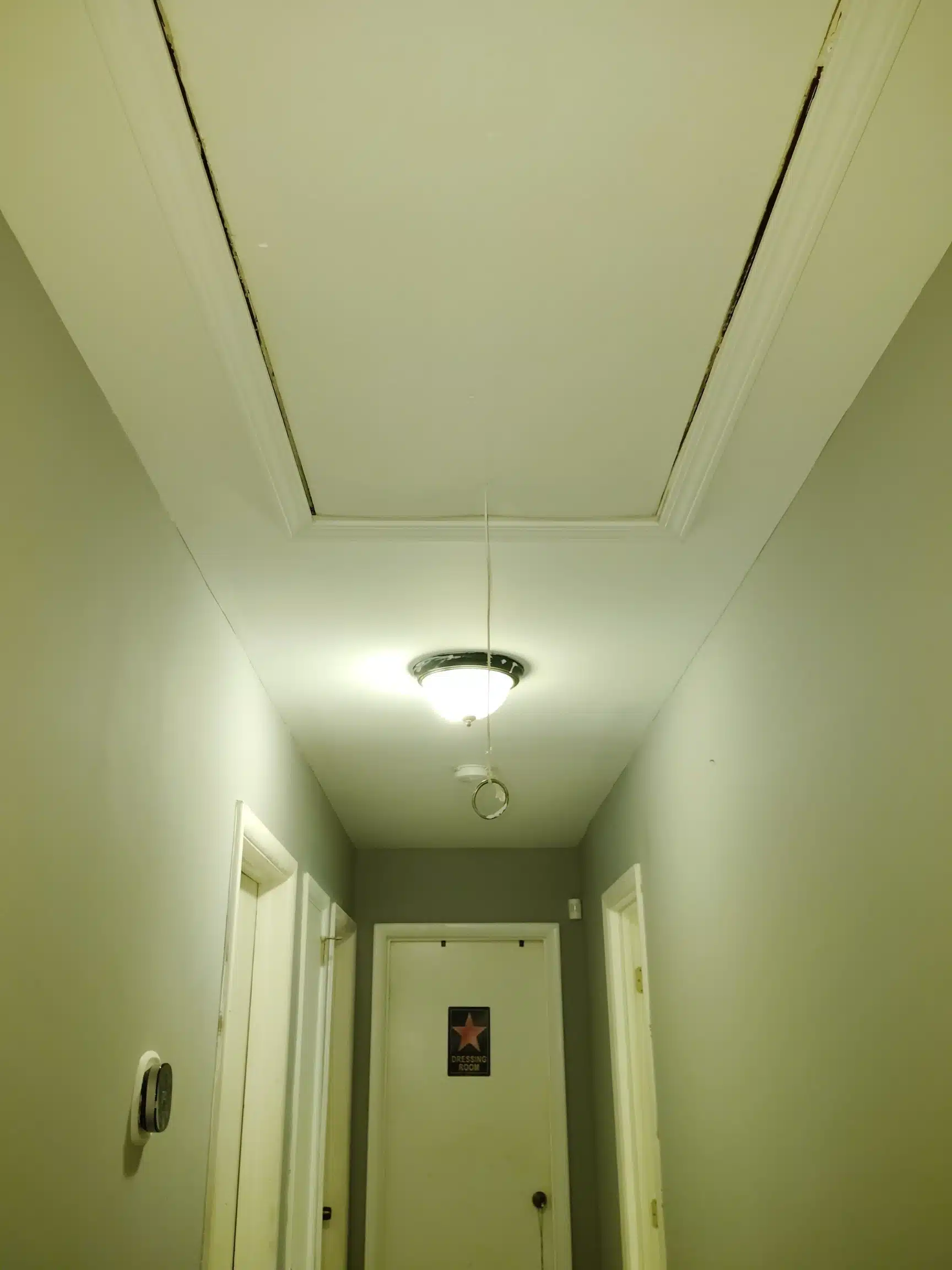 Hallway ceiling rebuilt around the light fixture and attic access hatch